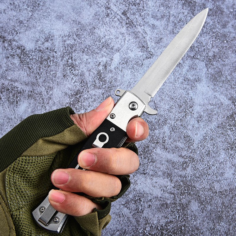 A multi-purpose open-door knife with a high-heavy folding knife and a fruit knife with a lock-and-cracker