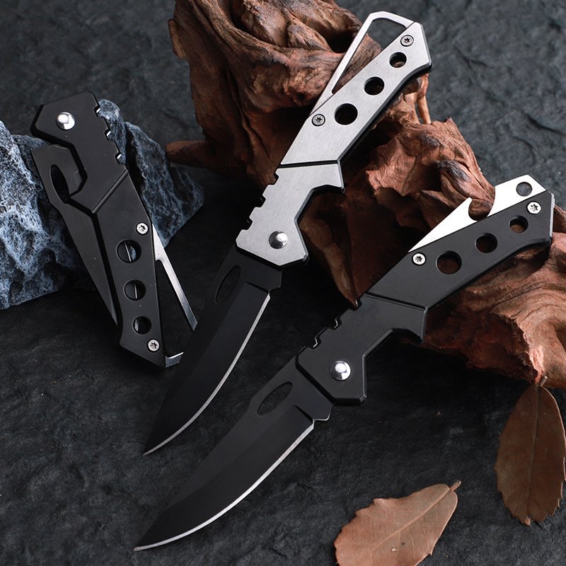 An outdoor folding of a small, stainless steel camper with a high-heavy fruit knife with a bottle opener key attached to the knife