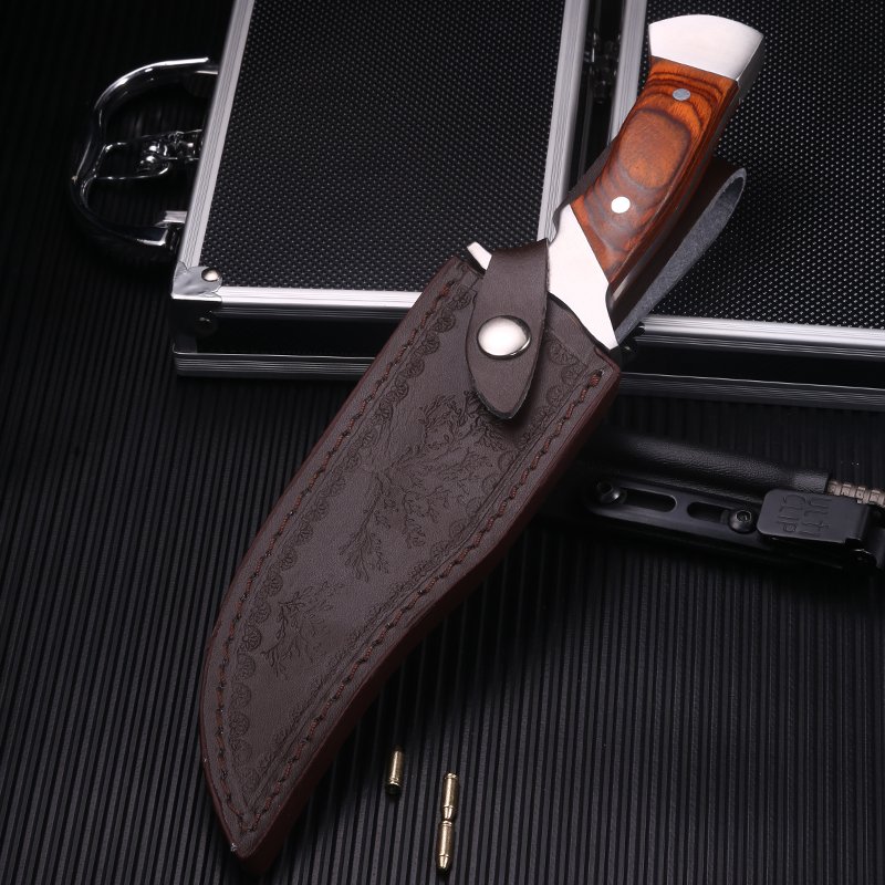 Outside the house, with a small knife, a high-strength camper, a sharp blade, a straight knife