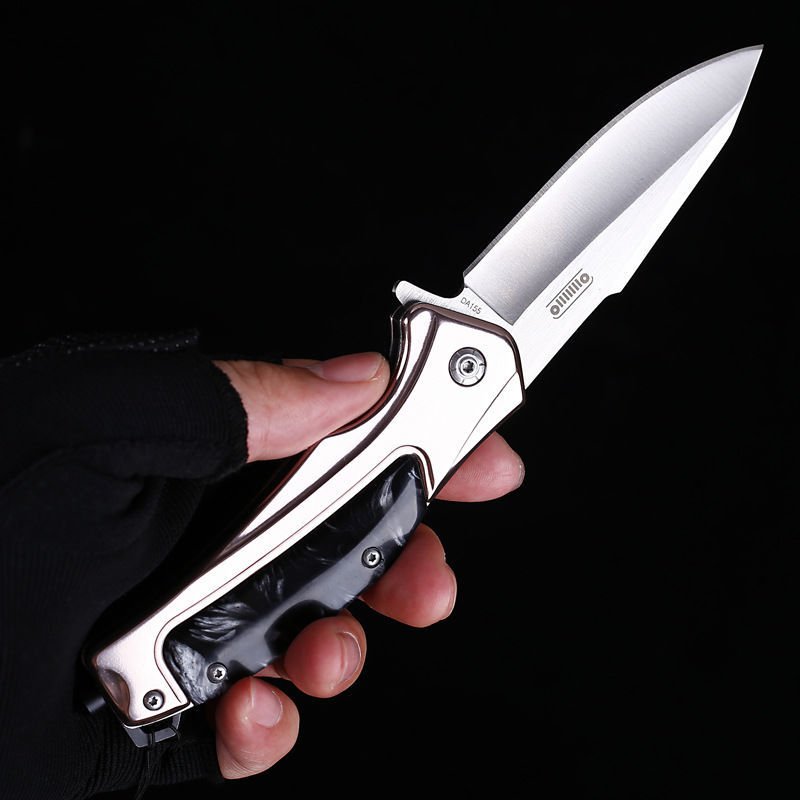 An outdoor multi-purpose folding of a Swiss military knife with a straight-on-the-scrap knife and a knife to survive in the field