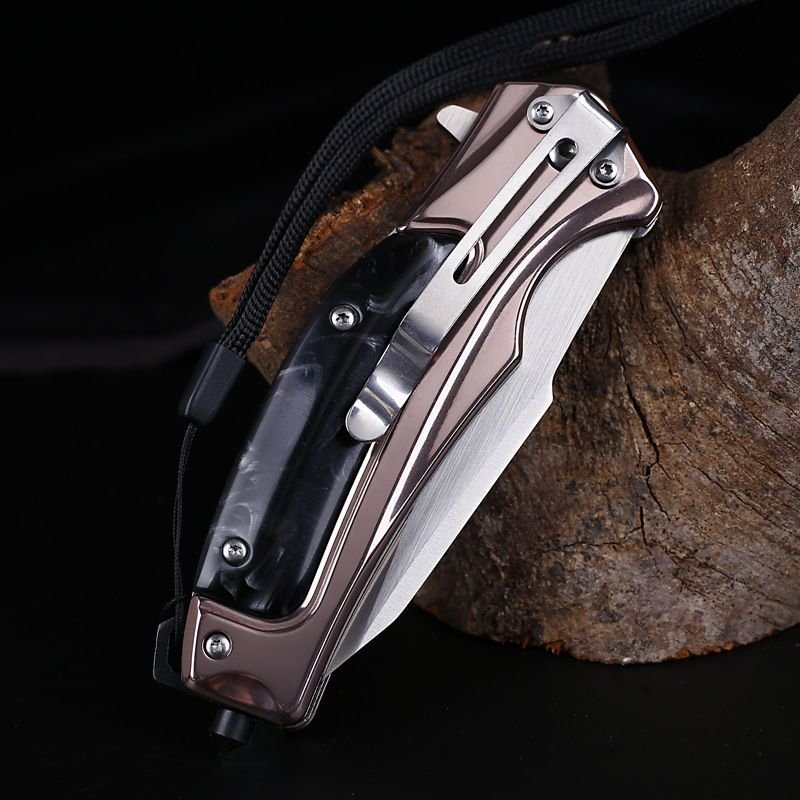 An outdoor multi-purpose folding of a Swiss military knife with a straight-on-the-scrap knife and a knife to survive in the field