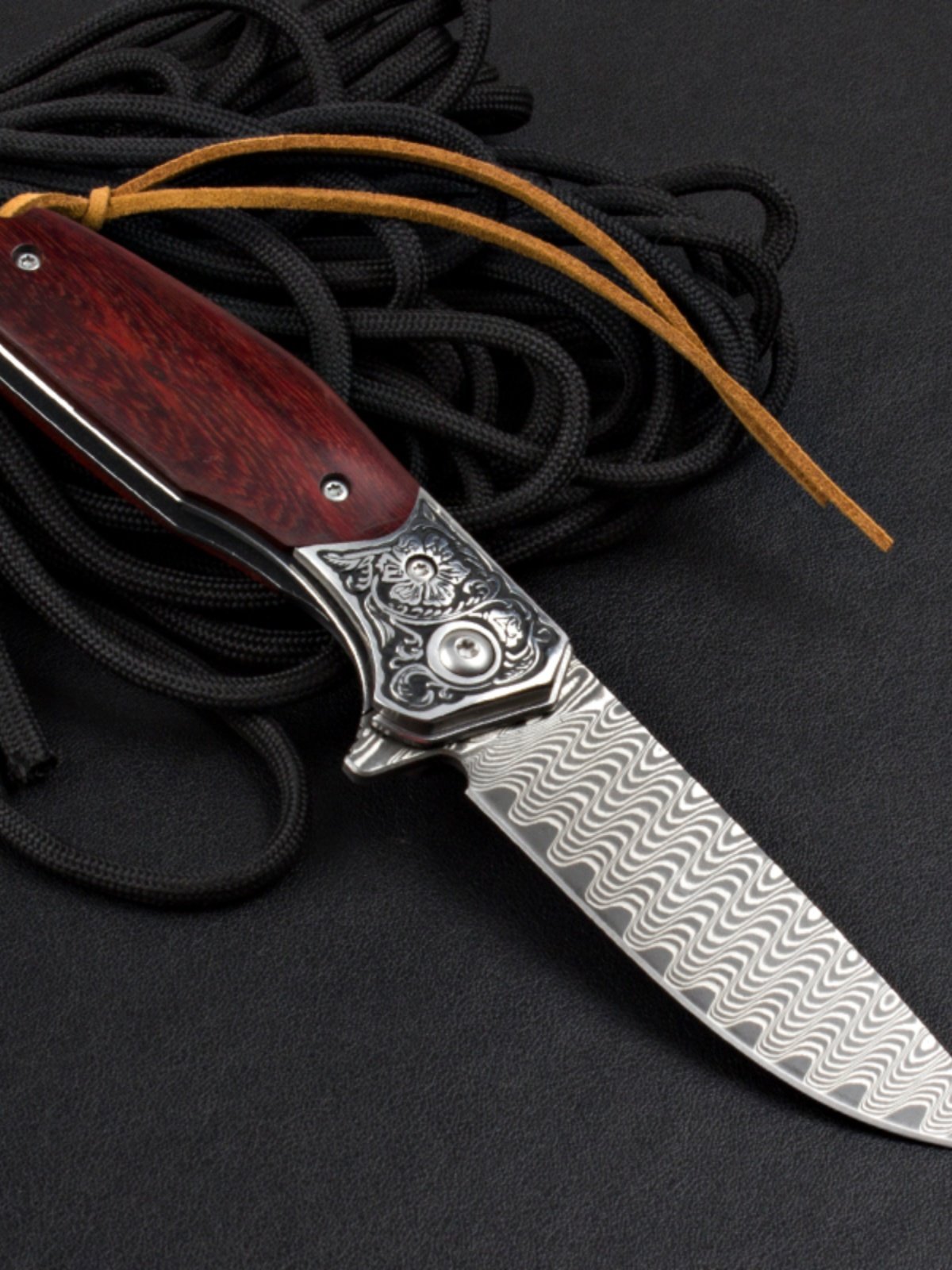 In the outdoors of Damascus, a multipurpose camper with a folding knife carries a small knife and a fruit knife