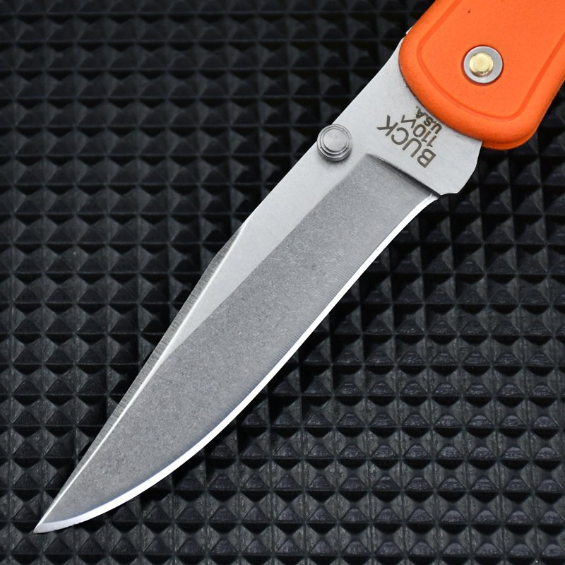 New Buck's field camping with a folding knife, and he's got a knife that's very hard to use