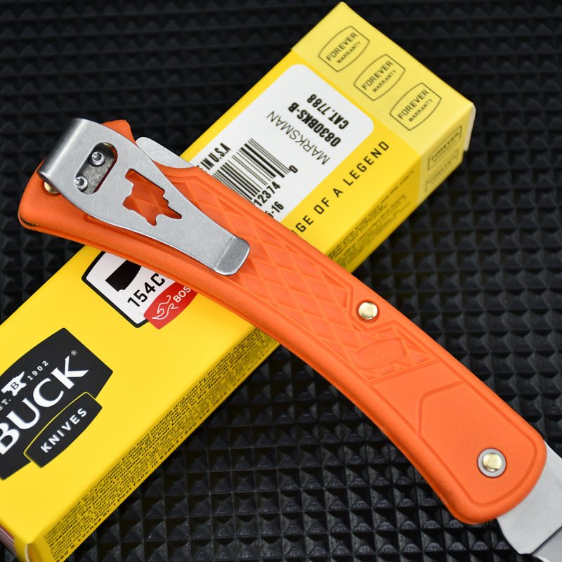 New Buck's field camping with a folding knife, and he's got a knife that's very hard to use