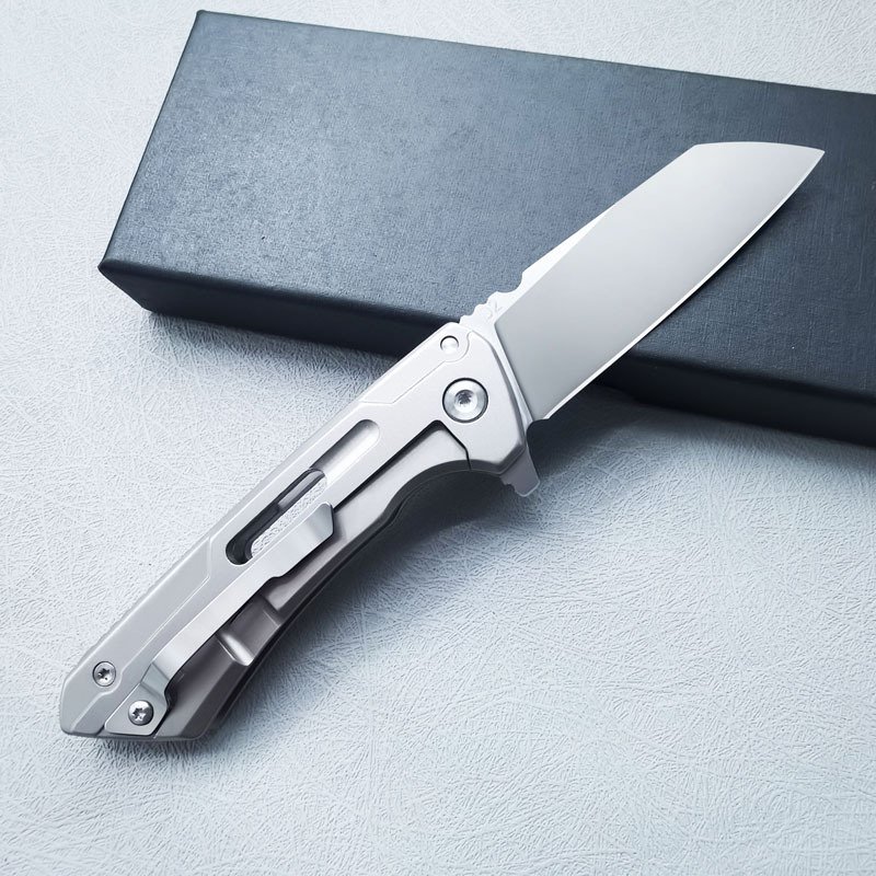 A FIELD CAMPING OF A FOLDING KNIFE WITH A SMALL D2 STEEL KNIFE FOR PROTECTION