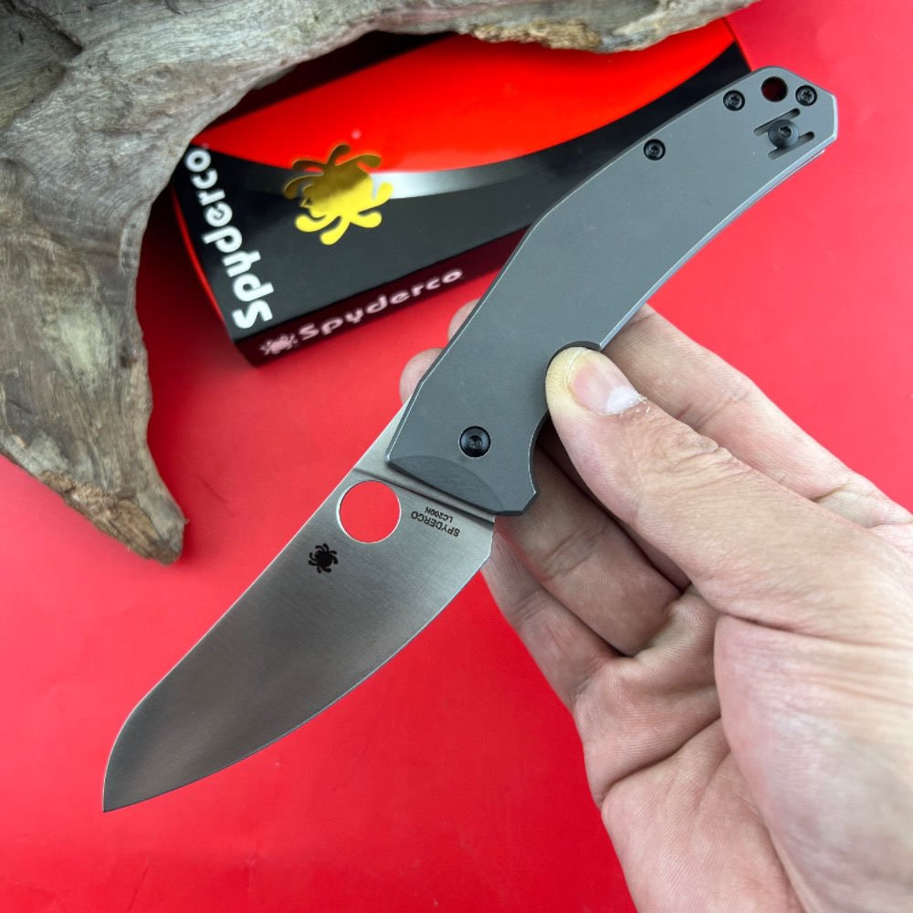 C211 TITANIUM ALLOY FOLDING KNIFE, AND THE FIELD CAMP CARRIES A FRUIT KNIFE WITH A SHARP SNAG
