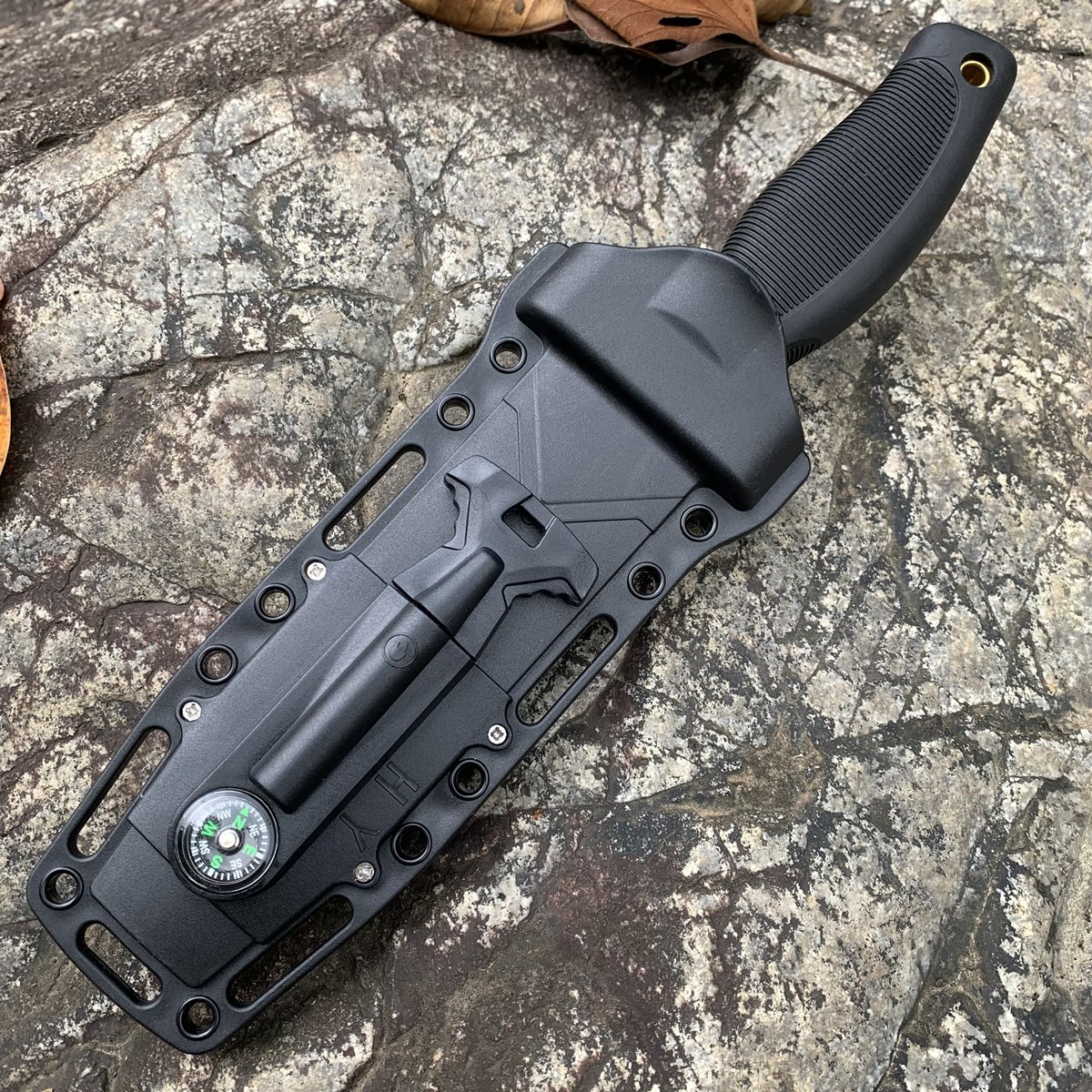 An outdoor knife with a multi-purpose straight blade and a high-intensity defensive knife camp