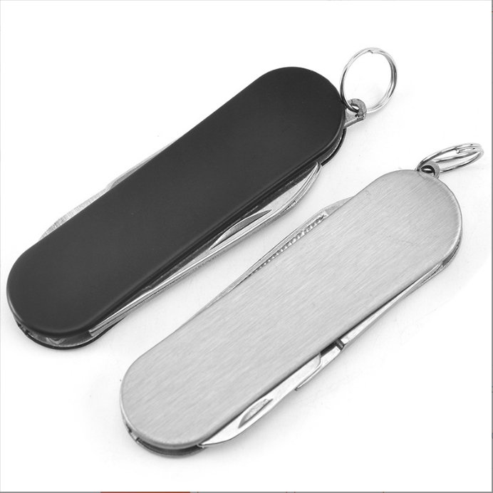 A multi-purpose folding knife outside the house with a stick-in-the-port key button with a stainless steel fruit knife
