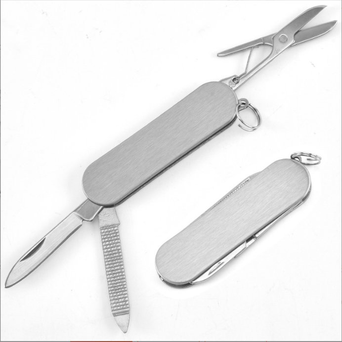 A multi-purpose folding knife outside the house with a stick-in-the-port key button with a stainless steel fruit knife