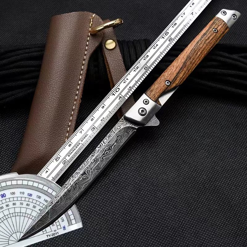 Damascus's tattooed knife outside the house, with a defensive knife folding into a multi-purpose sharp fruit knife