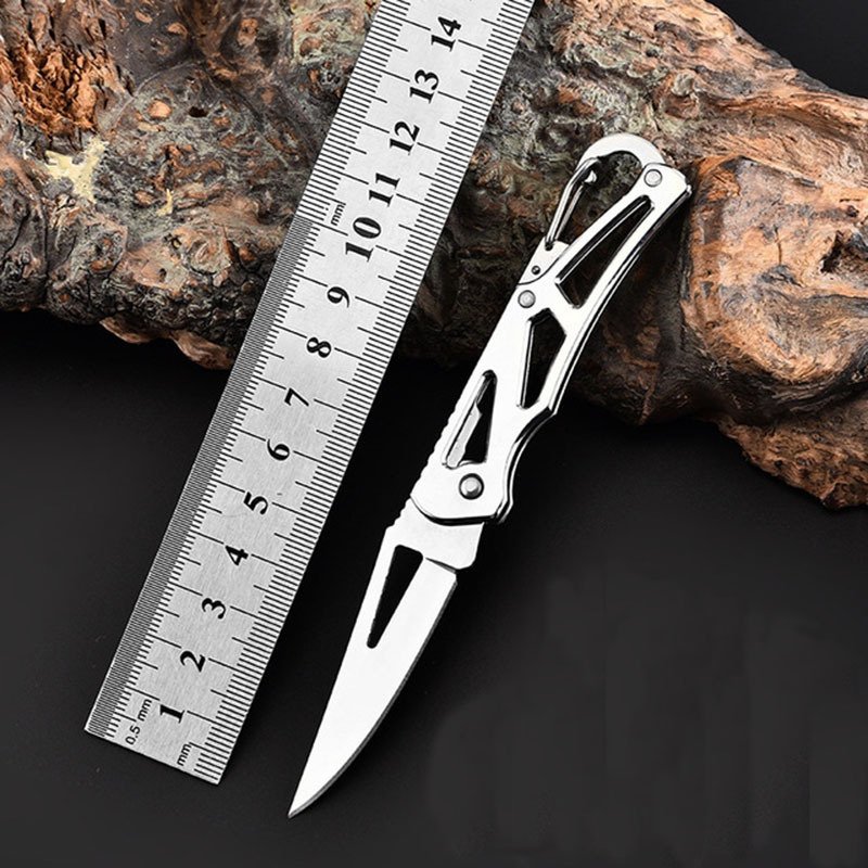 The stainless steel knife camping in a multi-purpose folding knife outside the house with a knife with a mini knife and a key knife