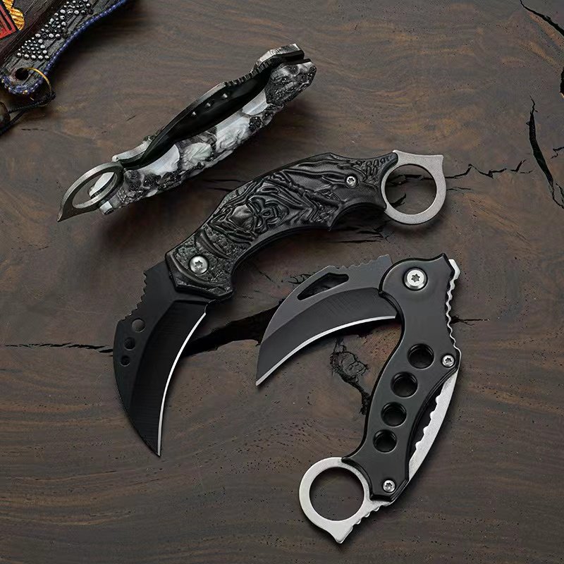 A knife with a mini-hawk claw and a coyote and a fruit knife with a machete