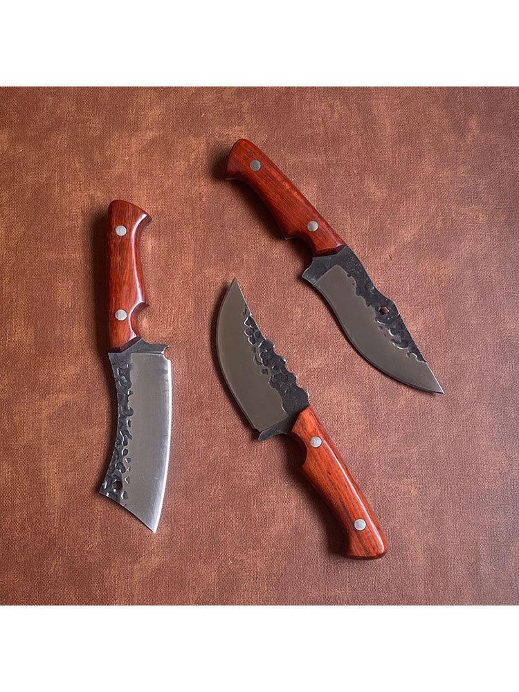 Inner Mongol hands with a cleaver and a fruit knife with a sharp, hard-to-exercise camper