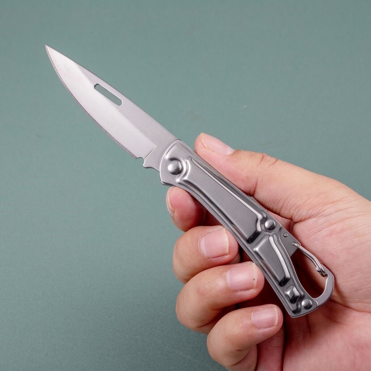The stainless steel key button with the folding knife and the multi-purpose opener knife