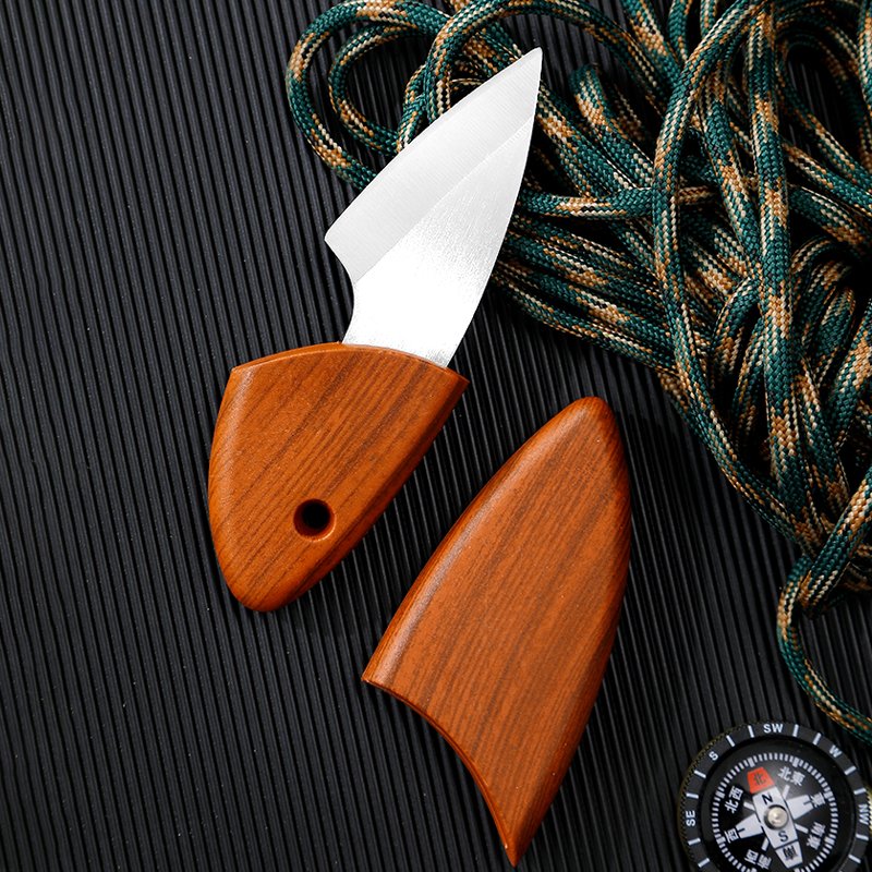 The new mini-chromium steel cutter outside the house with the little fat dolphin's pocket knife and the cutter