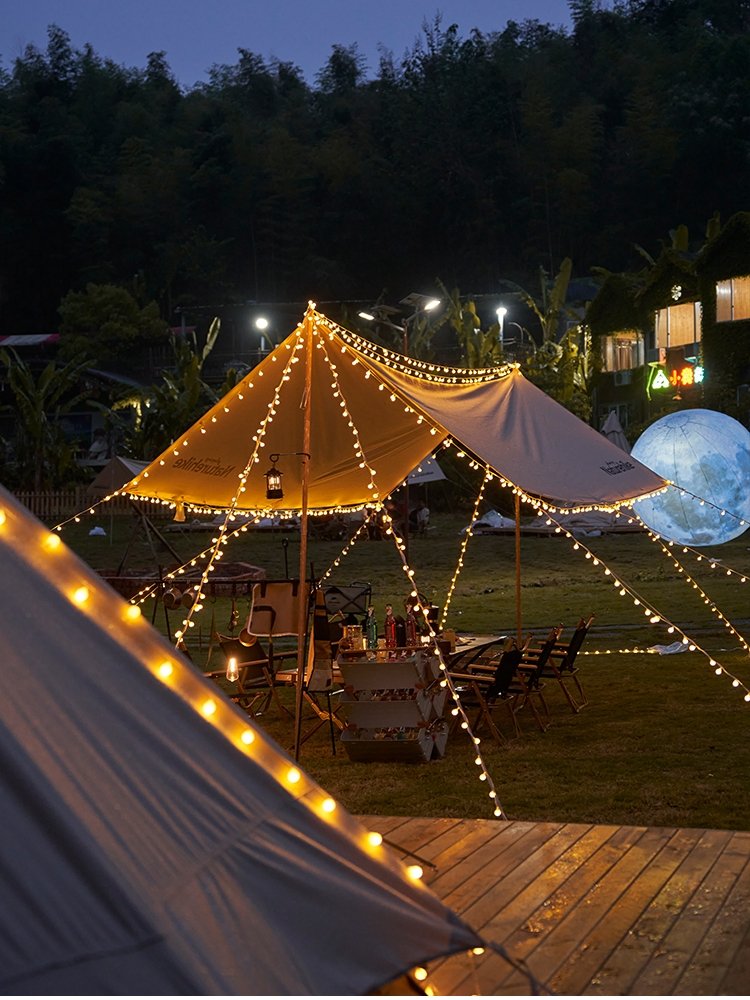 a light-lighted tent decorated with led light and a light-lighted light set in the camp atmosphere