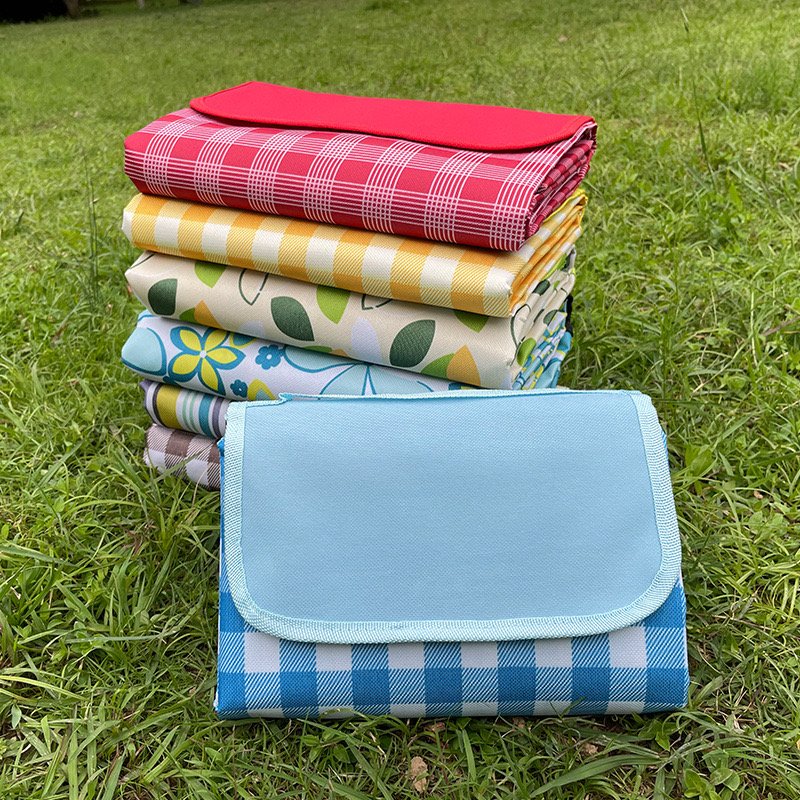 The picnic mats are thicker than the Oxford outdoor cooking camper