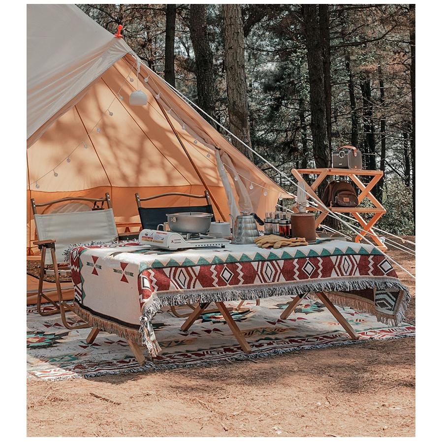 A camping blanket for the outdoor picnic table with a camping blanket for the Bohemia tent