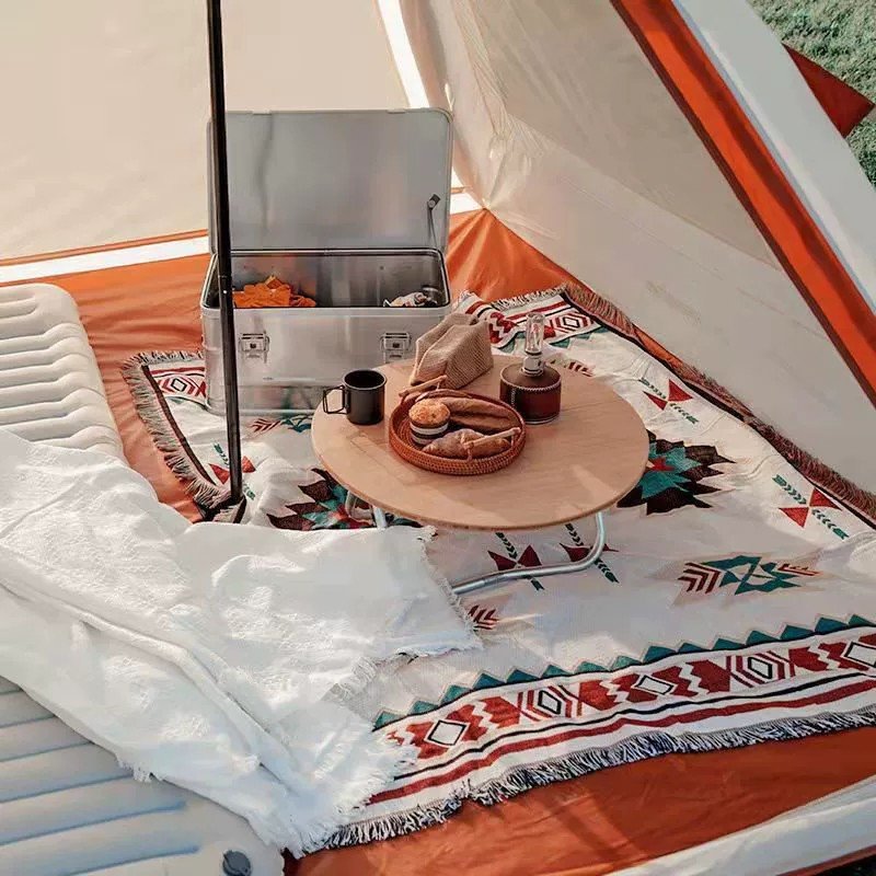 A camping blanket for the outdoor picnic table with a camping blanket for the Bohemia tent
