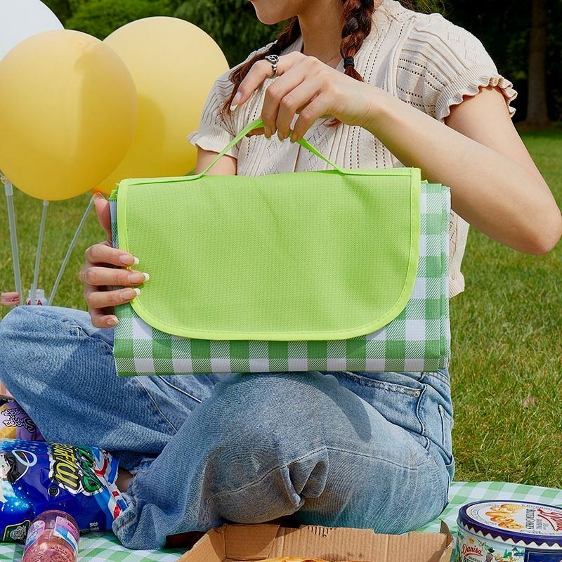 A picnic mat with a waterproof and tide-proof outdoor portable mattress can fold out the spring camping beach mats