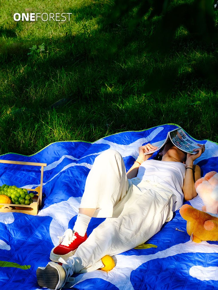 ONEFOREST, A PICNIC PAD WITH A THICK OUTDOOR CAMP PAD ON THE LAWN