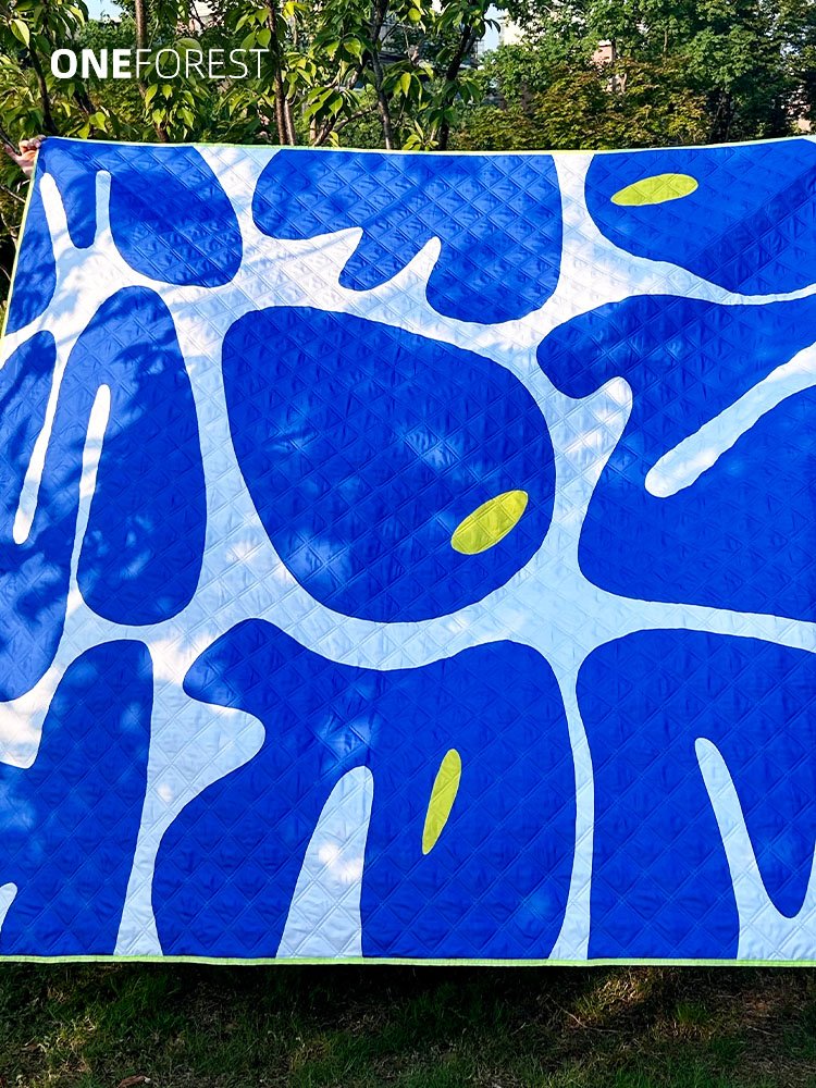 ONEFOREST, A PICNIC PAD WITH A THICK OUTDOOR CAMP PAD ON THE LAWN