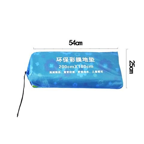 Outdoor damp pads and water damp-proof tent pads folded and camped on the beach with a lawn picnic