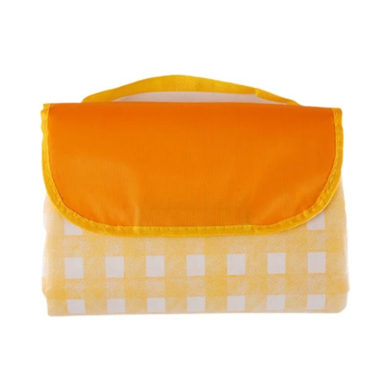 A picnic mat with a thick outdoor tent and a camping pad with a spring and field lawn
