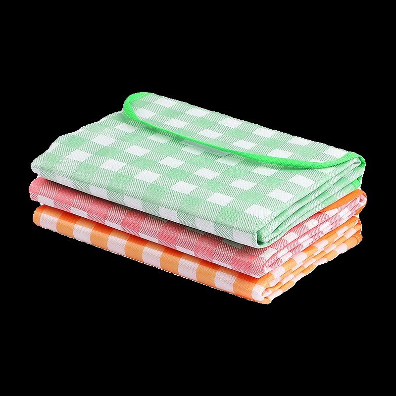 A picnic mat with a thick, unwieldy tarpaulin to fold a camping picnic on a wild-paining beach
