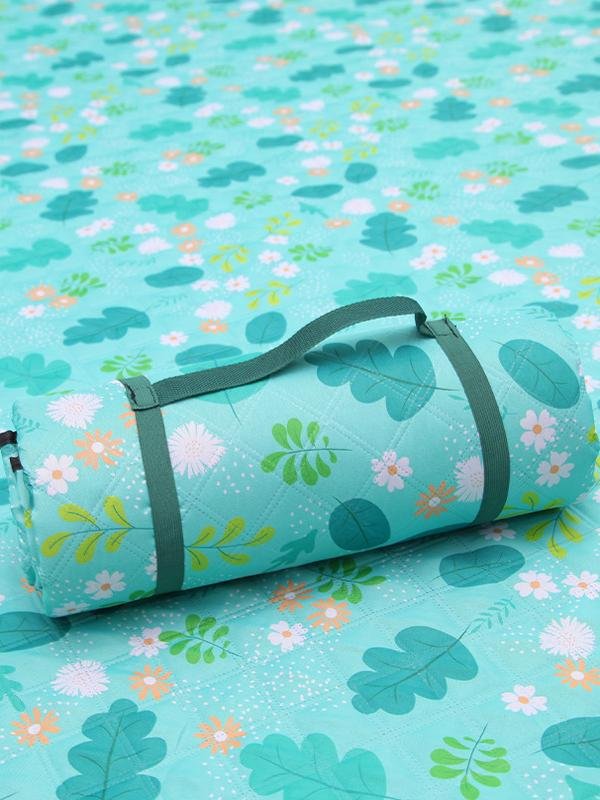 A picnic mat with an outdoor tent with a mattress in the lawn park and a watercooking pad thicken