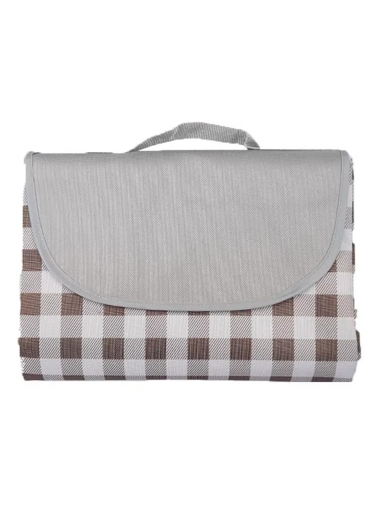 A picnic mat with a thick spring mat with a camping tent outside the field