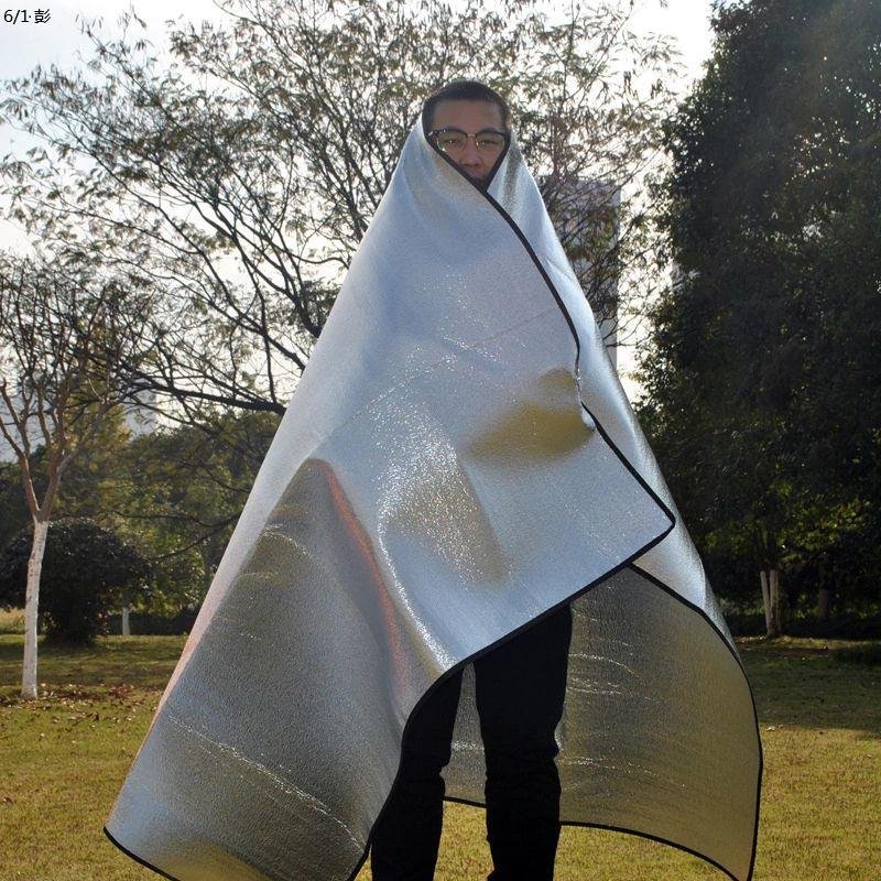 Two-faced aluminium membranes with a flood-proof mattress outside the tent