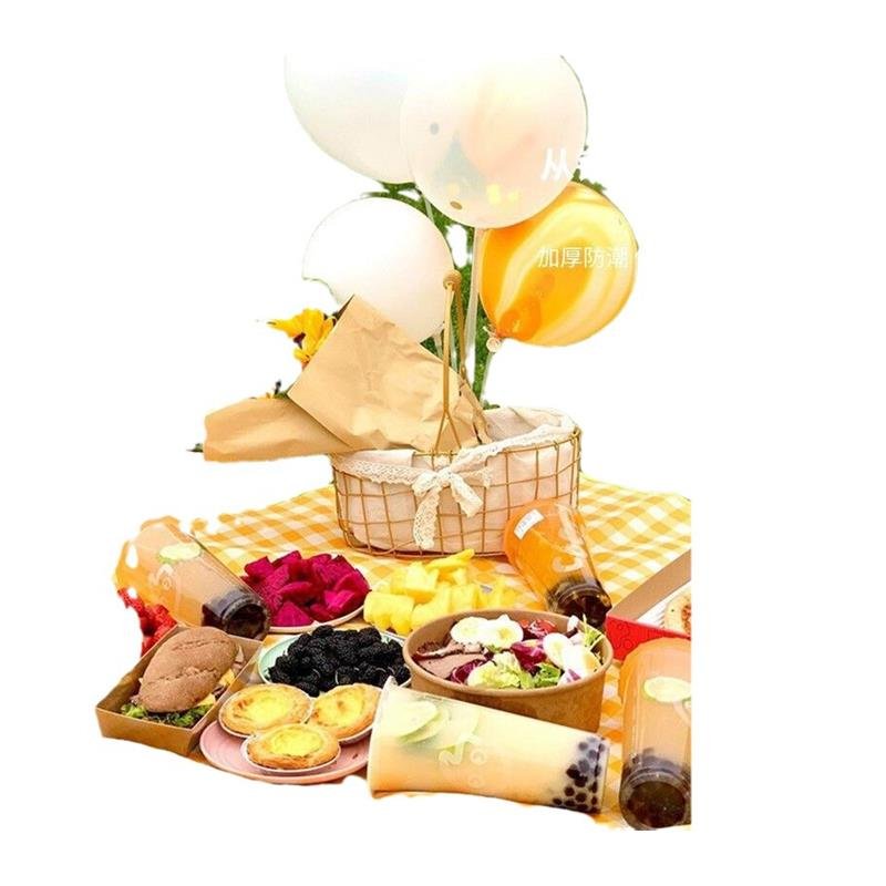 A picnic mat for the outdoor cooking camp tent with water and camping mats for the field