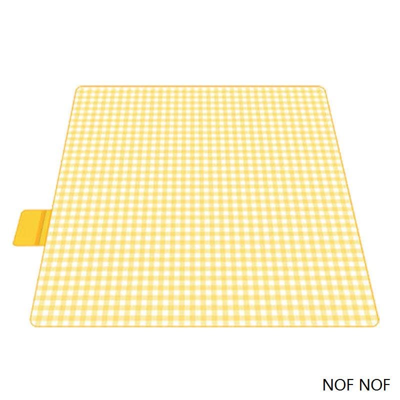 A picnic mat for the outdoor cooking camp tent with water and camping mats for the field