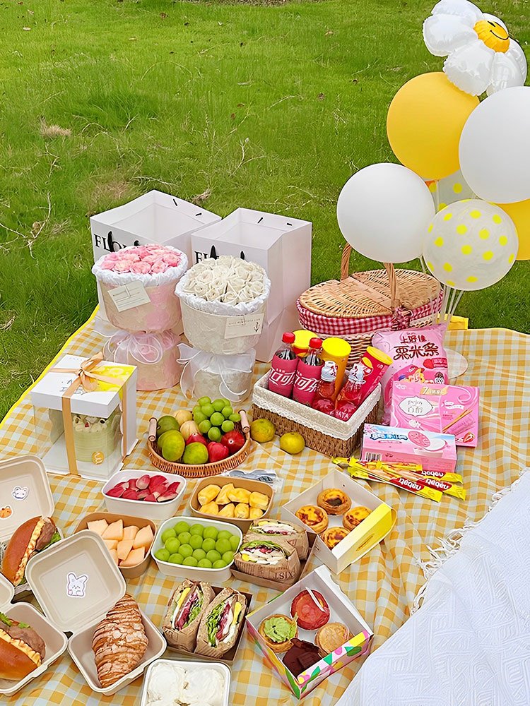 A picnic pad with a hot and thick pad and a beach tent against the lawn