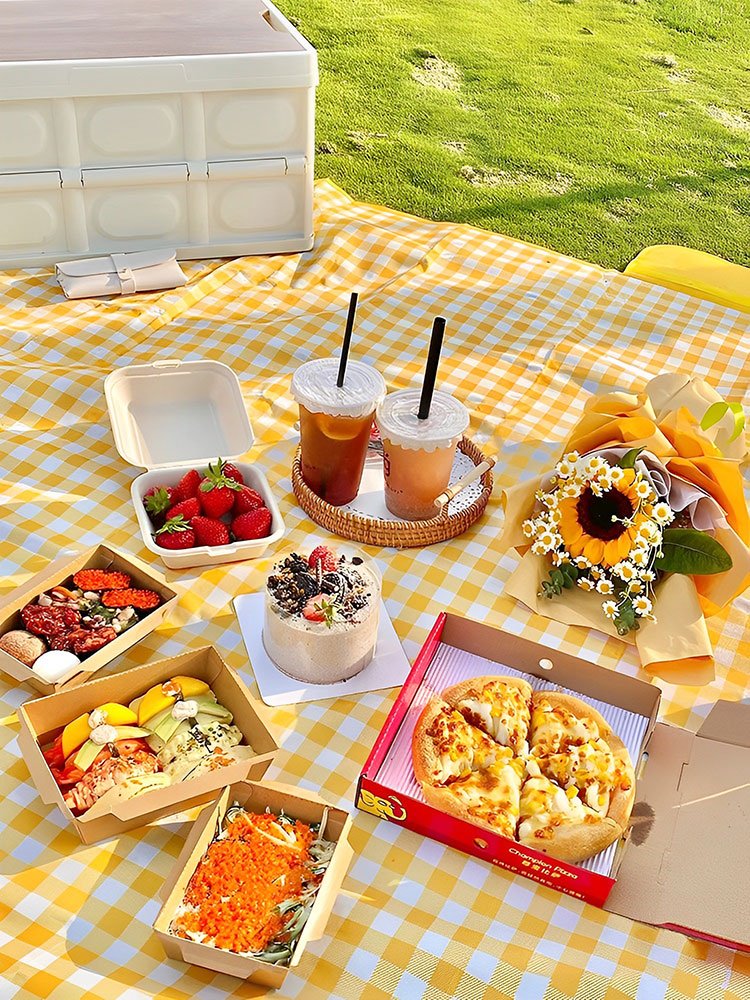 A picnic pad with a hot and thick pad and a beach tent against the lawn