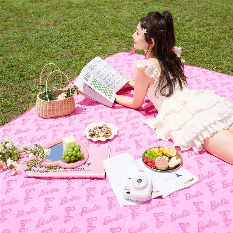 Barbie's picnic pad with a hot spring pad and a camping tent. The beach mat