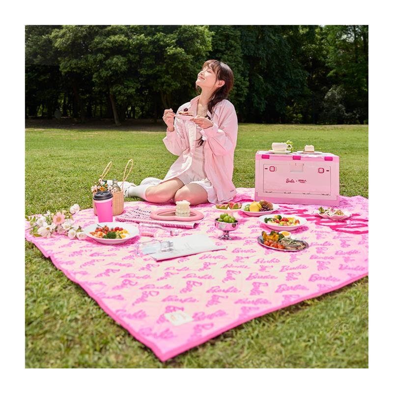 Barbie's picnic pad with a hot spring pad and a camping tent. The beach mat
