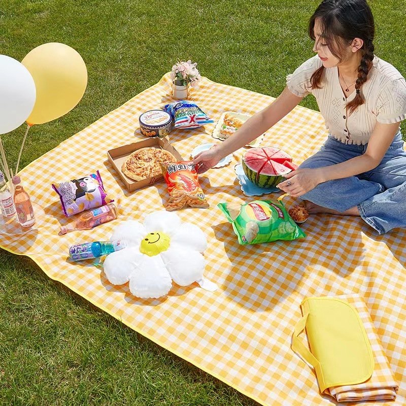 A picnic pad with a flood-proof, water-proof camping tent pad and a field trip