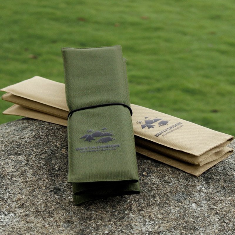 Outdoors with water-proof picnic pads and damp camp mats and sand beach travel