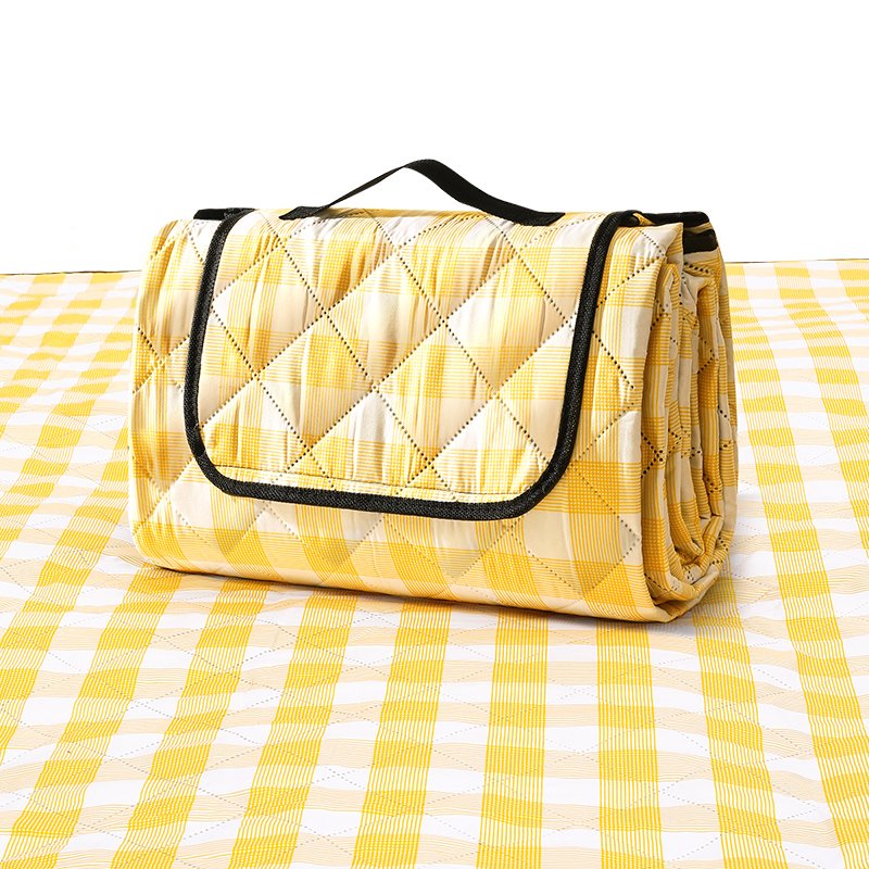 A picnic pad with a thick picnic pad with a waterproof pad and a portable camping tent seat