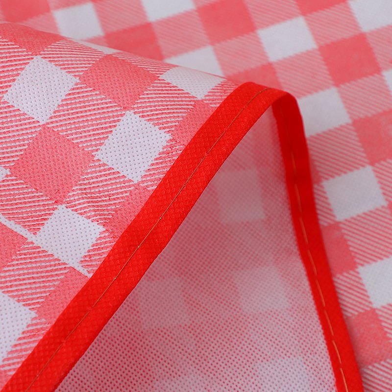 A picnic pad with water and portable outdoors for a picnic