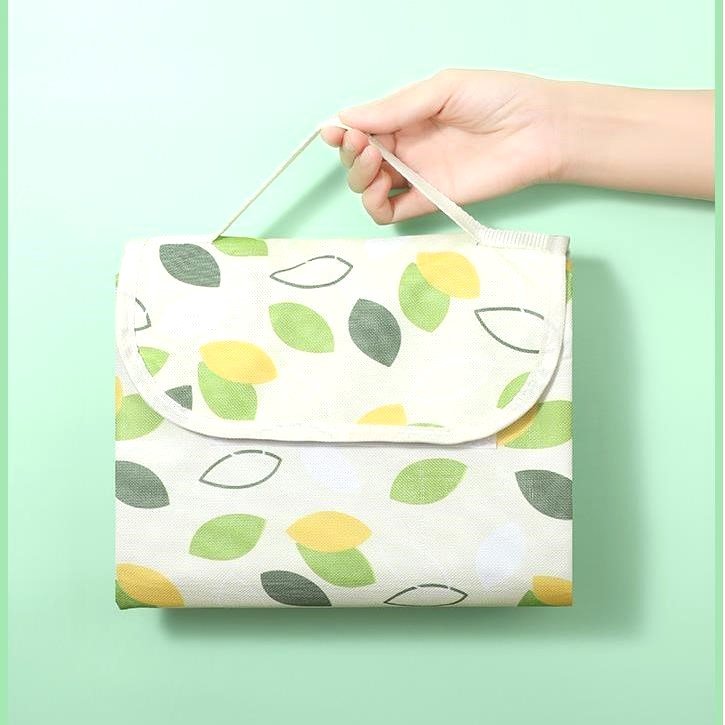 A picnic pad with water and portable outdoors for a picnic