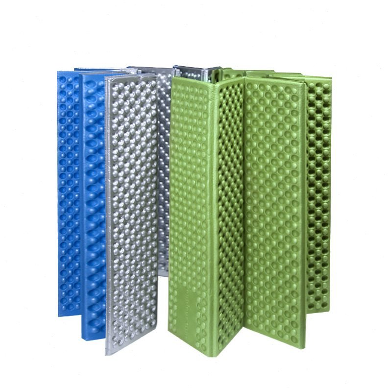 One-man outdoor camper folds a damp-proof egg chute and the students take a nap pad and a hive