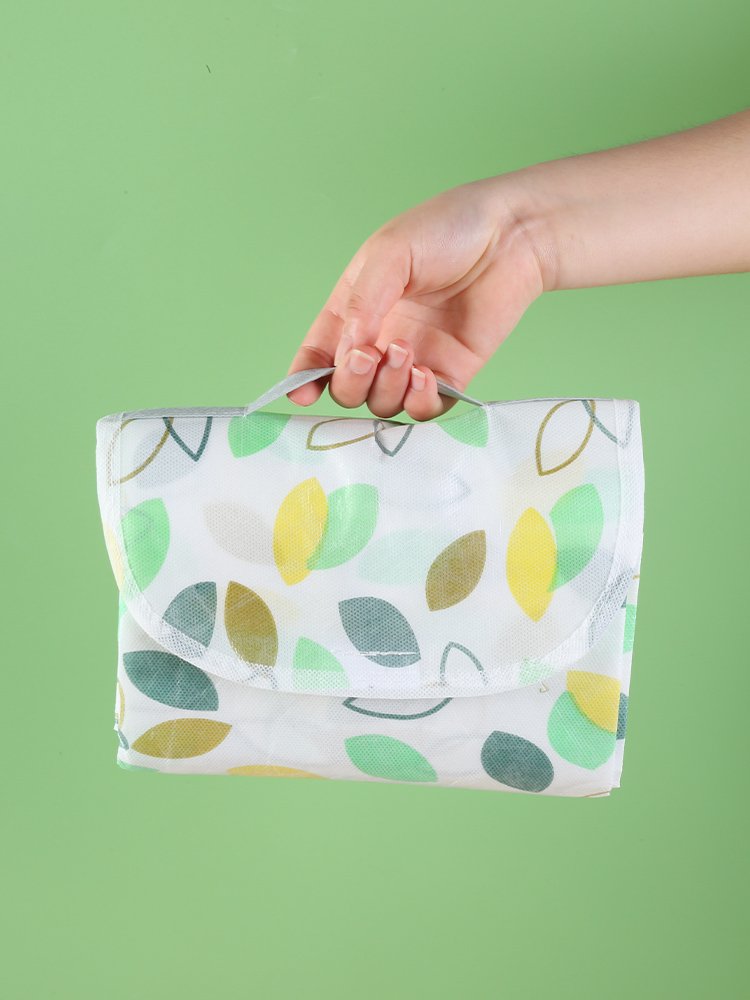 A picnic mat with a thick outdoor camping and a waterproof spring tarpaulin can fold