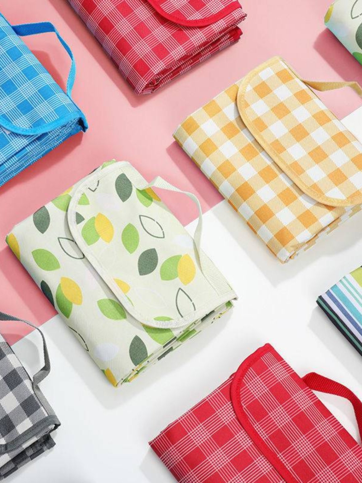 A picnic mat for the outdoor cooking camp tent with water and camping mats for the field