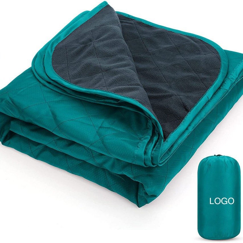 A picnic pad with a thick outdoor velvet and a camping blanket with a portable machine for blackwashing