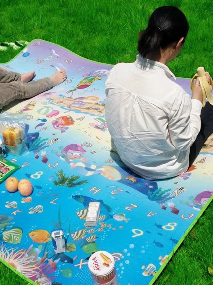 A picnic pad with a thick outdoor cooking camp camp tent with a water-grass pad folded