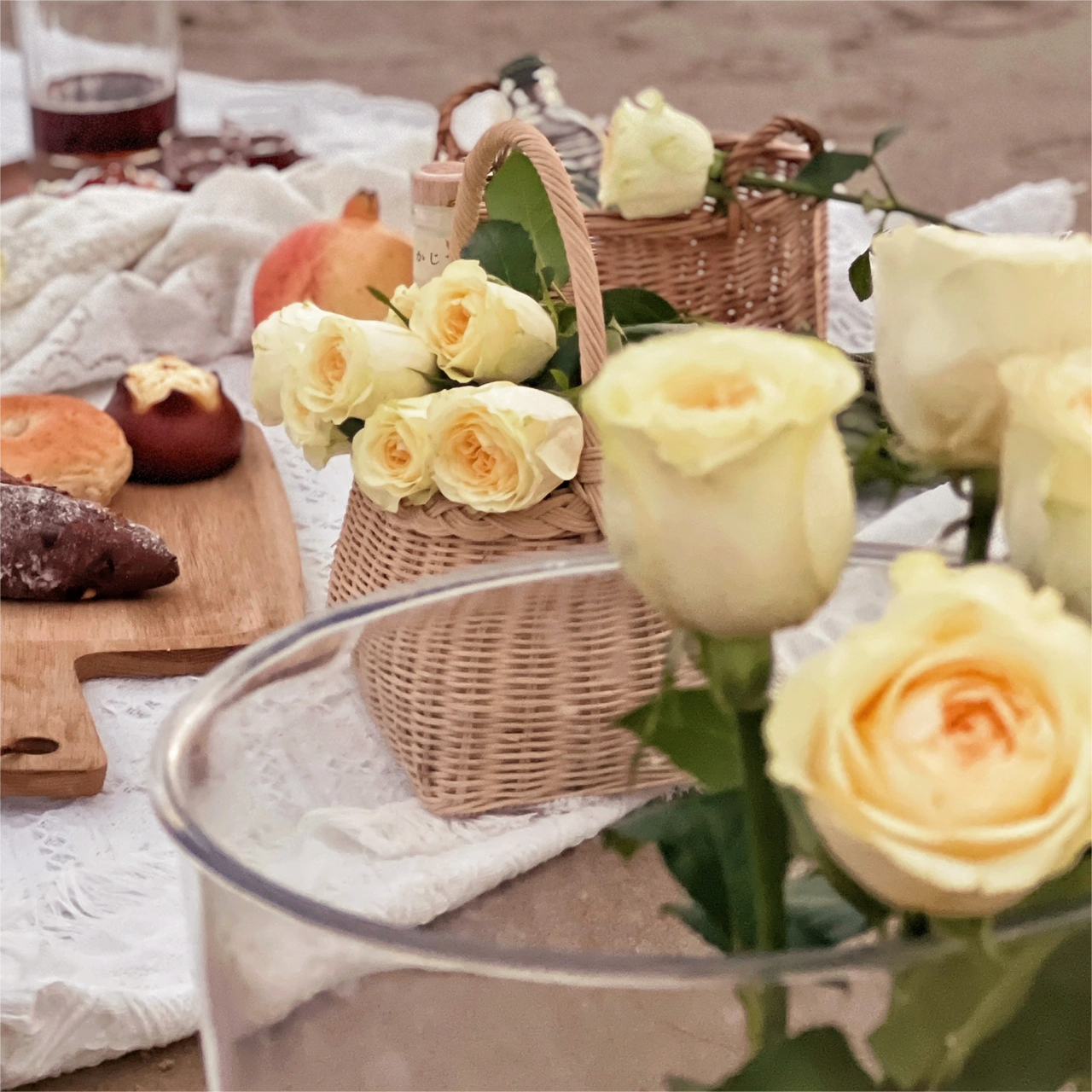 on the beach, white ins sand beach, thick outdoors, with a blanket that folds a picnic pad