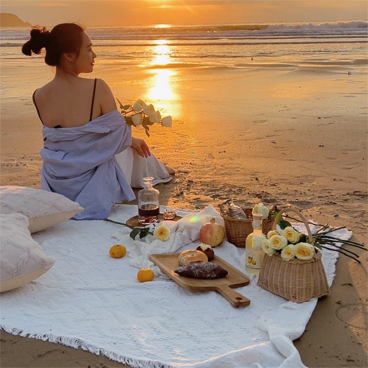 on the beach, white ins sand beach, thick outdoors, with a blanket that folds a picnic pad